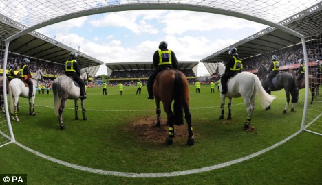 Teams line up in earlier meeting at Millwall