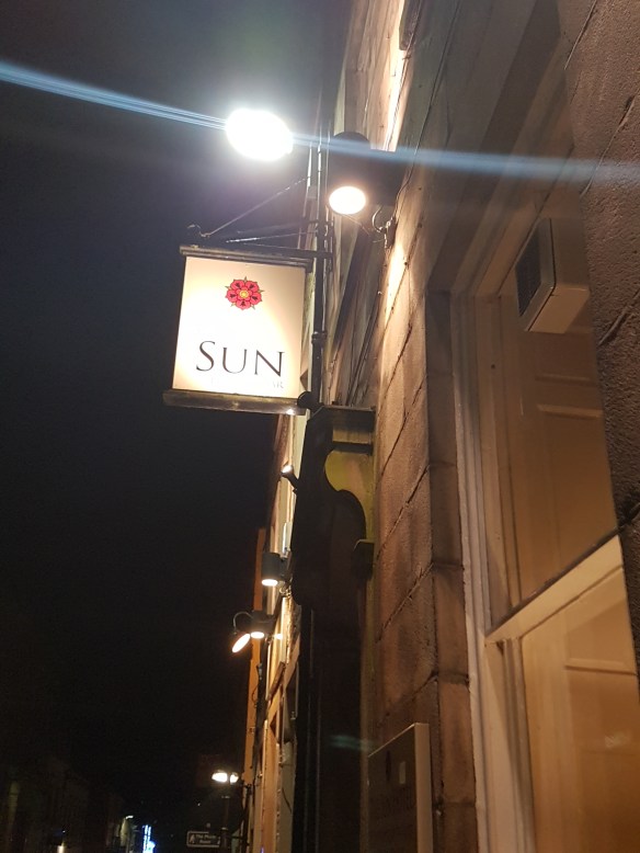 sun-at-night-sign